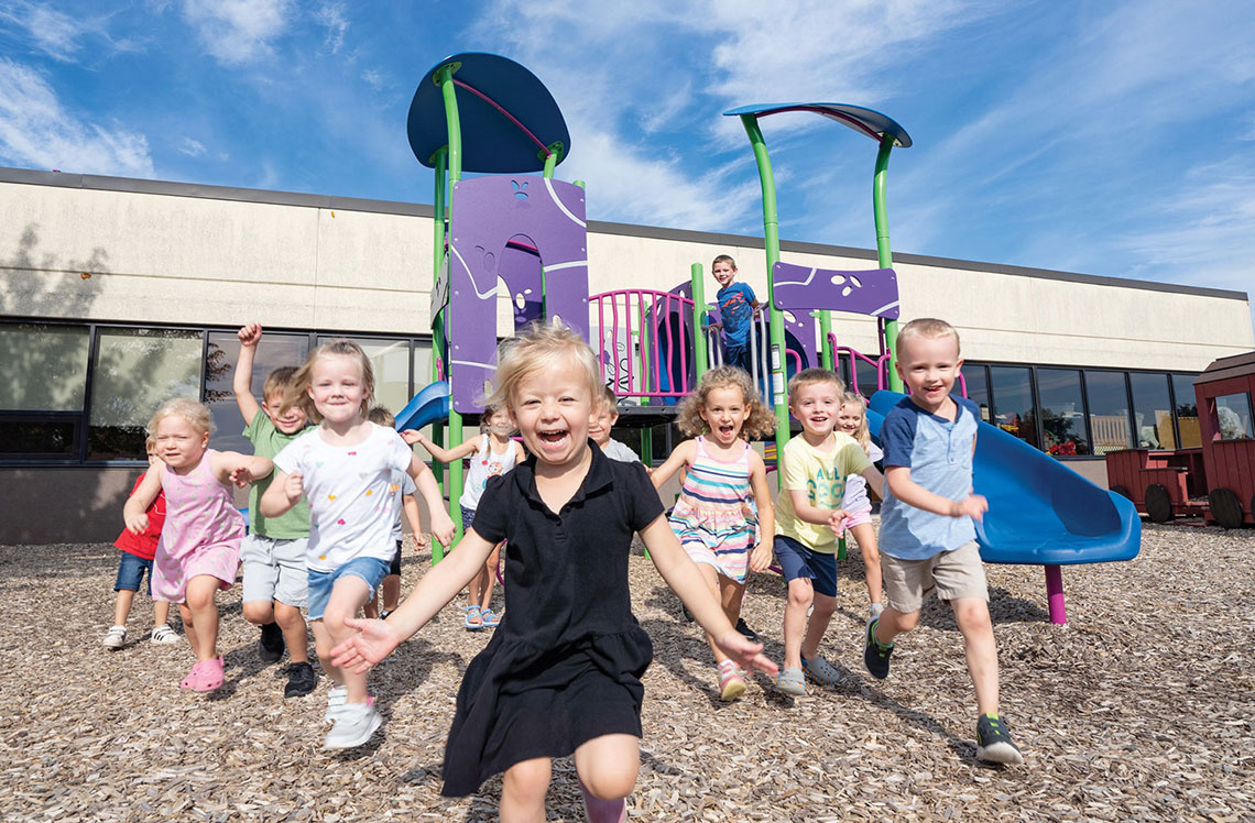 Children Using Playground Equipment at a Daycare